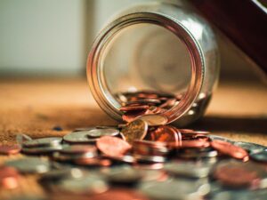 Image of coins spilling from a jar Photo by Josh Appel on Unsplash